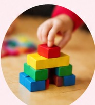 Colourful blocks being stacked by a child